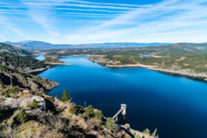 The Atazar reservoir and dam in the mountain range of Madrid.